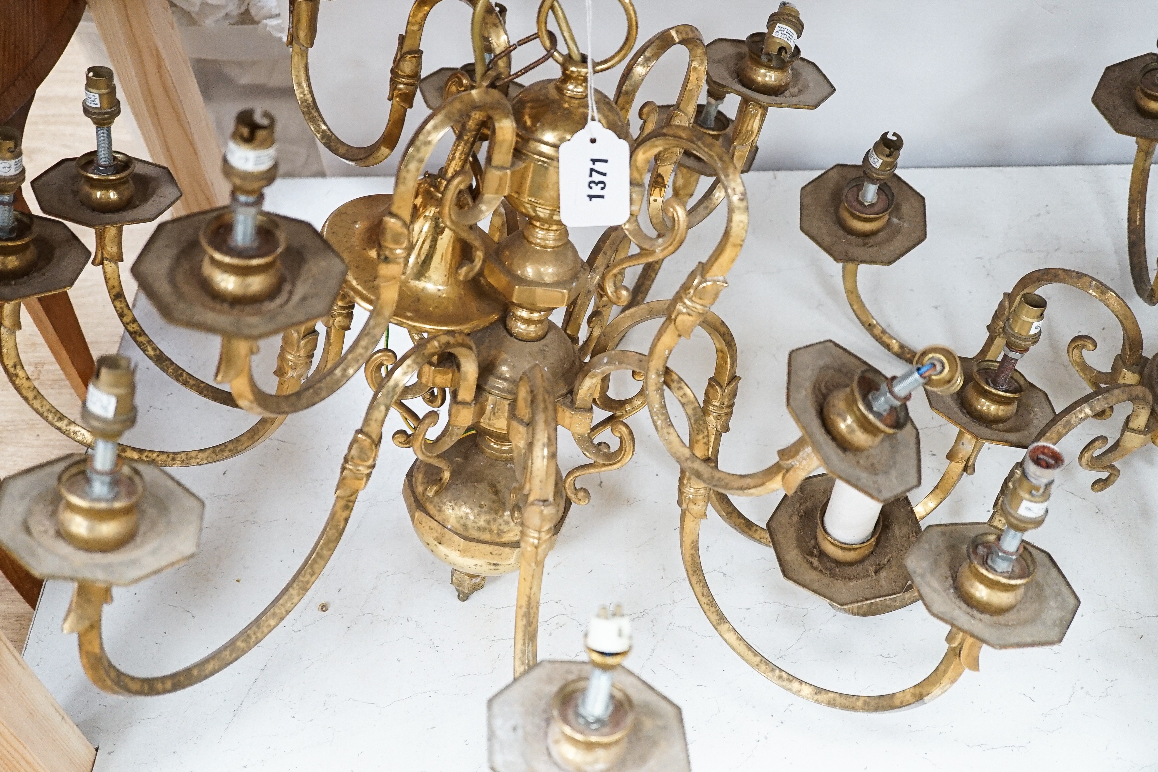 A brass two tier twelve branch electrolier and an associated six branch electrolier, 12 branch 46 cms high.